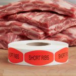 short ribs sticker on a red label with black text