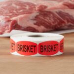 brisket sticker on a red label with black print