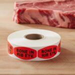 bone in rib eye sticker on a red label with black print