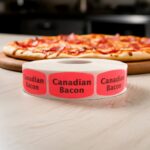 canadian bacon sticker on a red label with black print