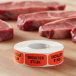 shoulder steak sticker on a red label with black text