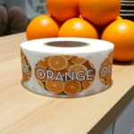 orange flavor sticker with oranges pictured on label