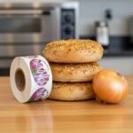 onion sticker next to some onion bagels