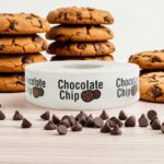 a roll of chocolate chip stickers with black text and a picture of cookies