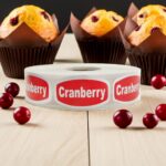 cranberry sticker with red background and white print