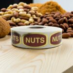 nuts sticker from a gold foil label with nuts behind it