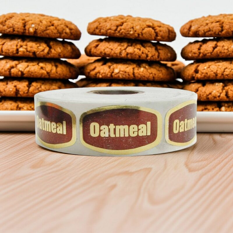 oatmeal label on a gold foil sticker with oatmeal cookies behind it