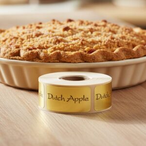 dutch apple sticker on a rectangle gold foil label in front of a dutch apple pie