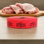 boneless sin hueso sticker on a red label with black print