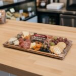 Charcuterie Board Sticker on a packaged charcuterie board