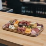 Charcuterie Board Sticker on a packaged charcuterie board showing meats and cheeses