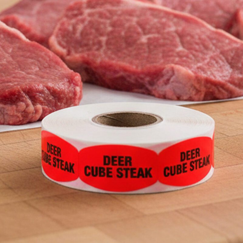deer cube steak sticker on a red label with black print