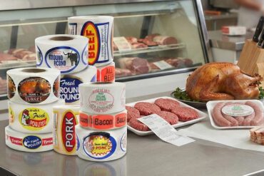 Butcher labels in a butcher shop showing the meat stickers on a table